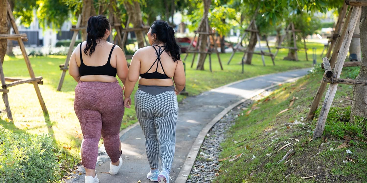 Plus-sized friends walking together